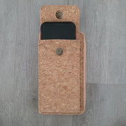 A compact adjustable strap crossbody and wallet in one, designed for hands-free convenience with timeless natural cork texture. 