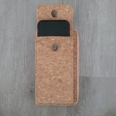 A compact adjustable strap crossbody and wallet in one, designed for hands-free convenience with timeless natural cork texture. 