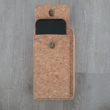 A compact adjustable strap crossbody and wallet in one, designed for hands-free convenience with timeless natural cork texture. 