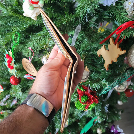 Side view Lightweight and durable, this bi-fold wallet is crafted from premium natural cork. Waterproof and equipped with RFID protection to keep your cards safe. E