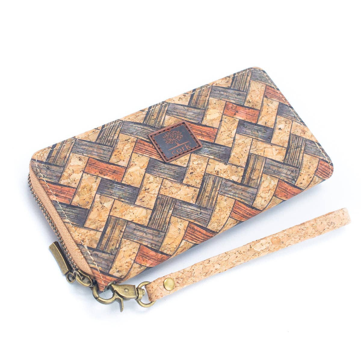 Cork wallet with herringbone pattern and strap on a white background