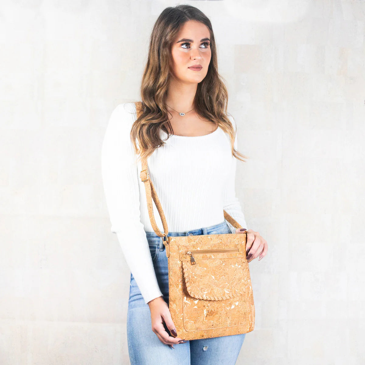 Braided front flap detail on natural cork handbag