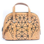 Front view of geometric cork handbag with black line pattern