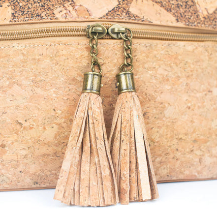 Close up view of tassels on cork crossbody bag