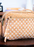 Front view of stunning natural and daisy print cork crossbody bag 