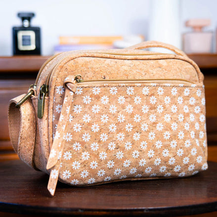 Front view of stunning natural and daisy print cork crossbody bag 
