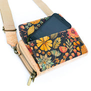 Floral patterned crossbody bag with a phone inside on a white background
