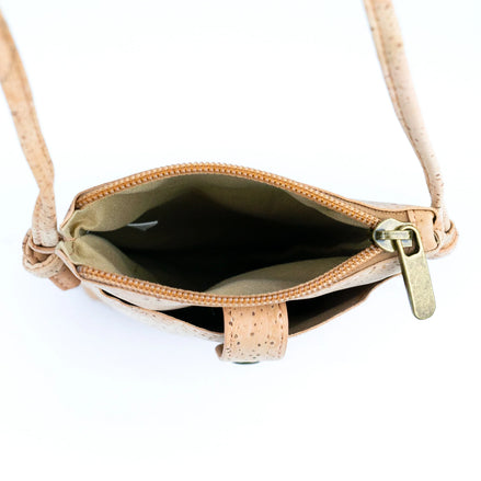 Interior view A compact &amp; stylish cork crossbody phone bag designed with gold flakes in the cork for those grab-and-go days. 