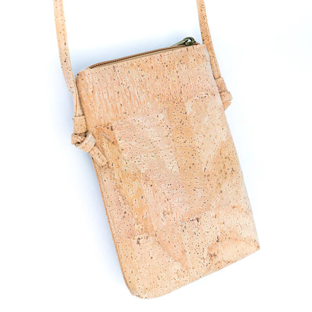 Back view A compact &amp; stylish cork crossbody phone bag designed with gold flakes in the cork for those grab-and-go days. 