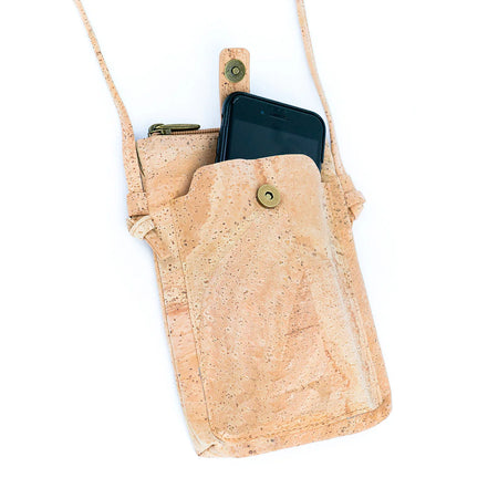 A compact &amp; stylish cork crossbody phone bag designed with gold flakes in the cork for those grab-and-go days. 