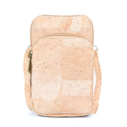 A compact cork crossbody phone bag with three zippered compartments with a detachable and adjustable shoulder strap designed for grab-and-go days.