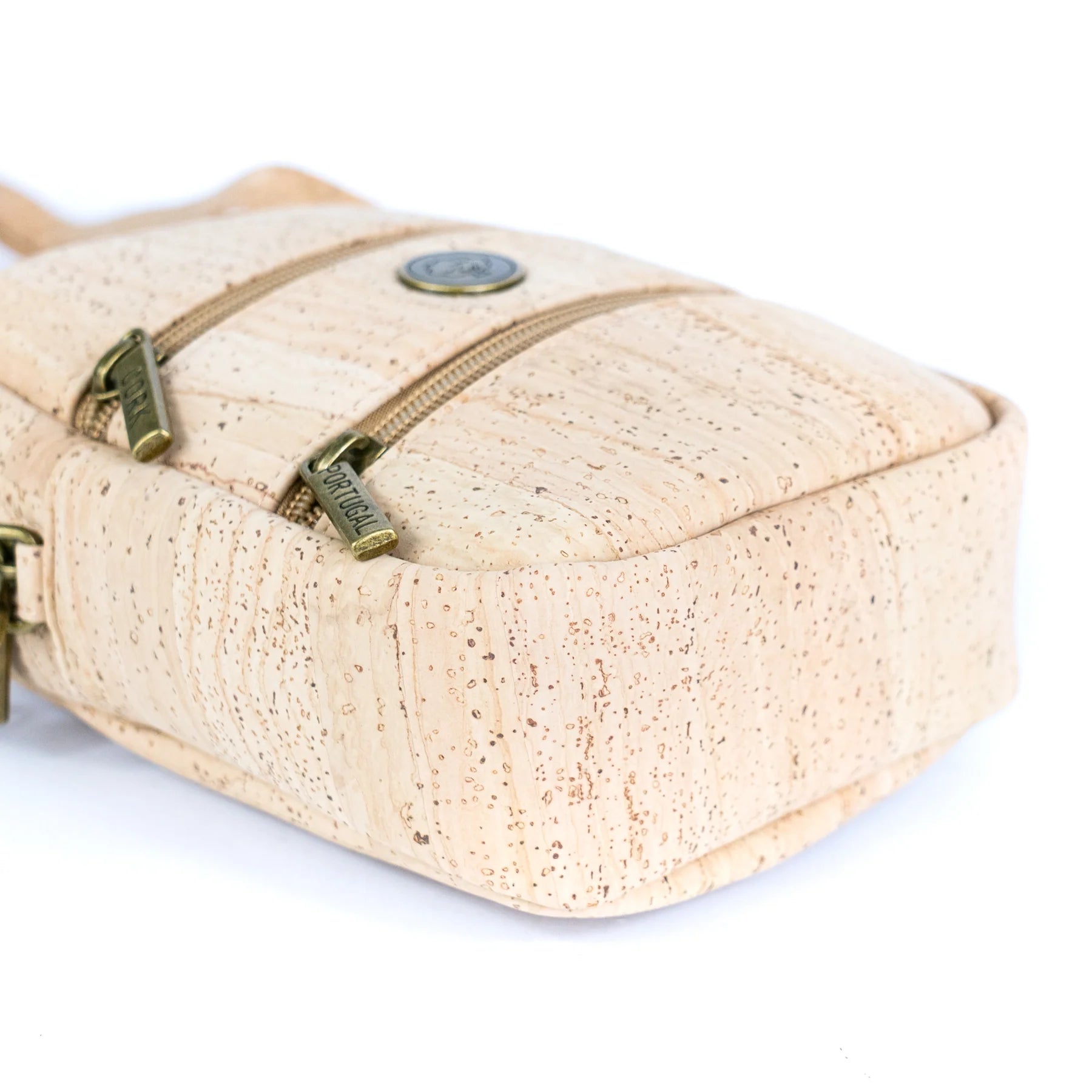 Bottom view of natural cork crossbody phone bag with dual zippers