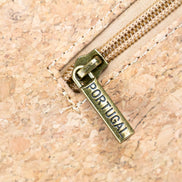 Close up antique brass hardware cork crossbody