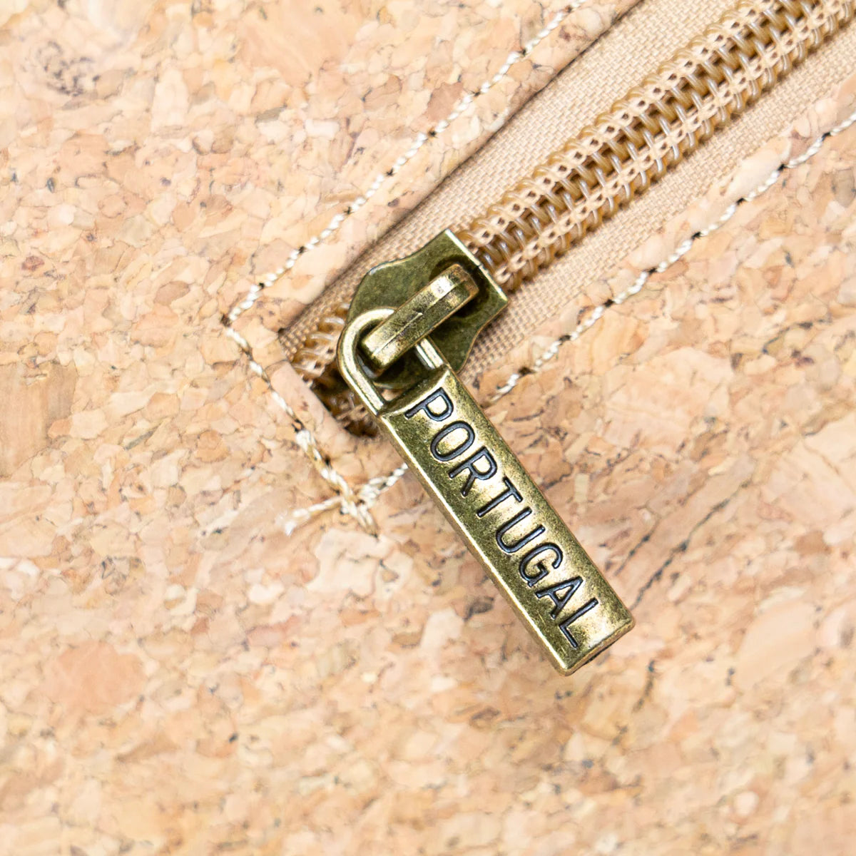 Close up antique brass hardware cork crossbody