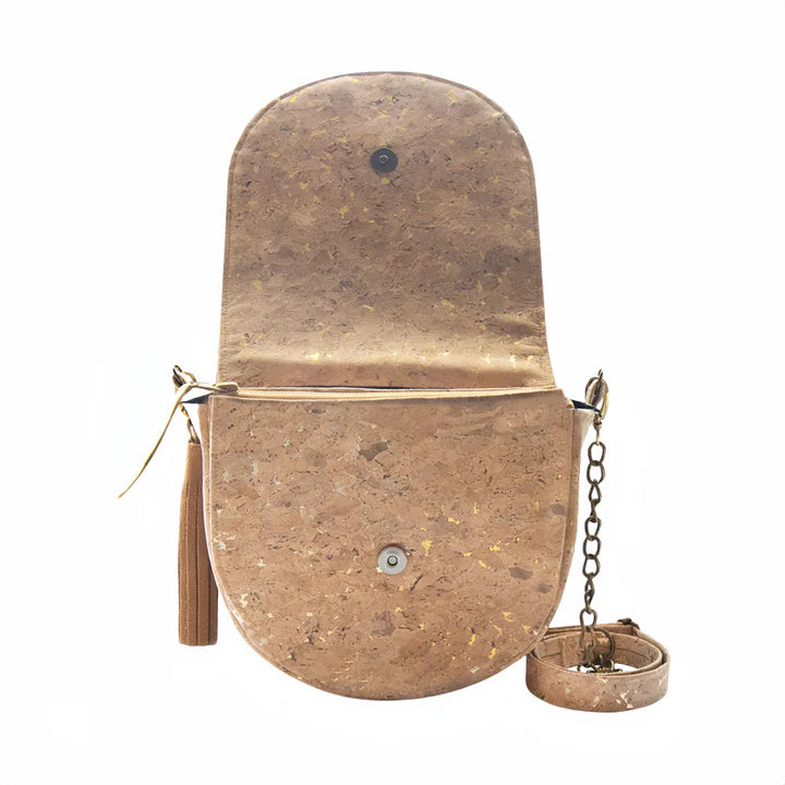 Natural cork crossbody bag with gold flake finish, front view with tassel and detachable strap.