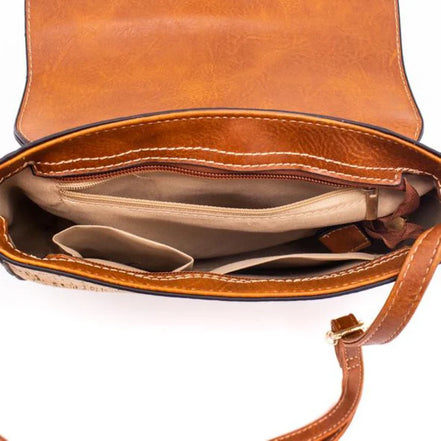 Natural cork crossbody bag front view with gold button detail and adjustable strap