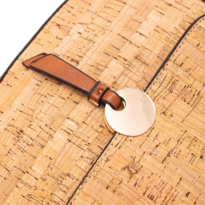 Natural cork crossbody bag front view with gold button detail and adjustable strap