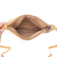 Interior view Art-inspired cork crossbody bag with two front zip pockets and lightweight, vegan durability. Stylish, sustainable, handcrafted in Portugal.