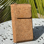 A compact adjustable strap crossbody and wallet in one, designed for hands-free convenience with timeless natural cork texture. 