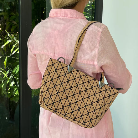 Stylish geometric design tote or shoulder bag with natural cork texture and large interior compartment for wallet, tablet, notebooks &amp; more.