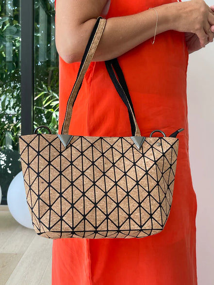 Stylish geometric design tote or shoulder bag with natural cork texture and large interior compartment for wallet, tablet, notebooks &amp; more.