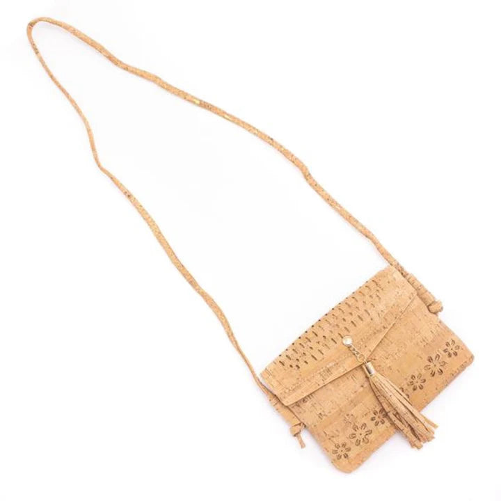 A chic, laser cut out cork crossbody that keeps your essentials close while staying feather-light. 