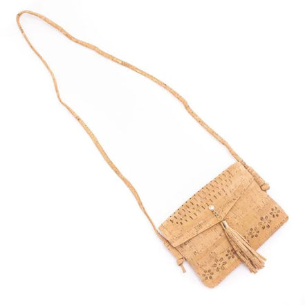 A chic, laser cut out cork crossbody that keeps your essentials close while staying feather-light. 