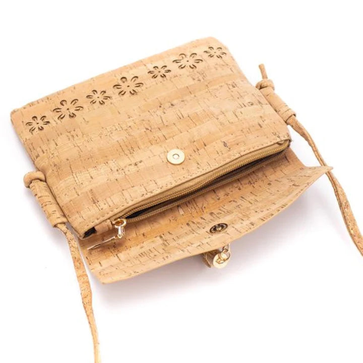 A chic, laser cut out cork crossbody that keeps your essentials close while staying feather-light. 