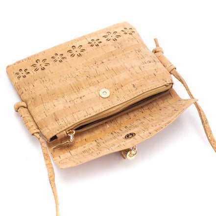 A chic, laser cut out cork crossbody that keeps your essentials close while staying feather-light. 