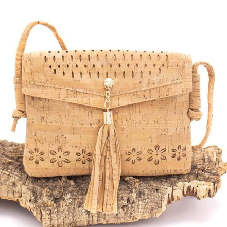 A chic, laser cut out cork crossbody that keeps your essentials close while staying feather-light. 