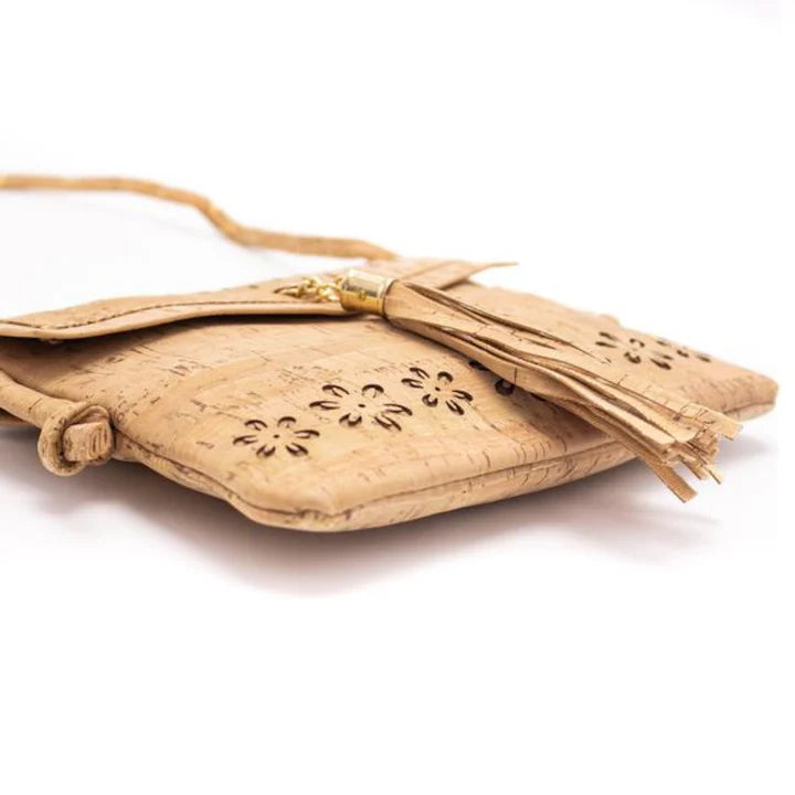 A chic, laser cut out cork crossbody that keeps your essentials close while staying feather-light. 