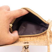 A chic, laser cut out cork crossbody that keeps your essentials close while staying feather-light. 