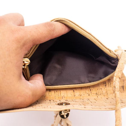 A chic, laser cut out cork crossbody that keeps your essentials close while staying feather-light. 