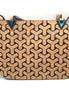 Cork handbag with geometric pattern on a white background