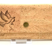 Cork wallet with a bird design and a snap on a white background