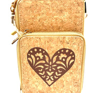 Cork handbag with a decorative heart cutout on a white background