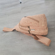Natural cork sling bag front view with zipper front pocket