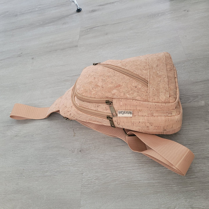 Natural cork sling bag front view with zipper front pocket
